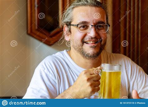 Man Drinking Beer Of Handsome Man Drinking Beer While Sitting Stock