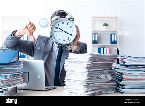 Businessman With Heavy Paperwork Workload Stock Photo Alamy