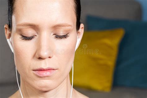 Close Up Portrait Of Attractive Relaxed Young Woman Meditating And