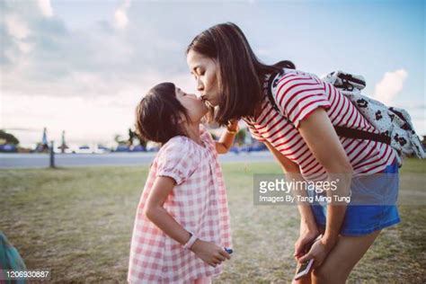Mother Daughter Kissing Lips Bildbanksfoton Och Bilder Getty Images