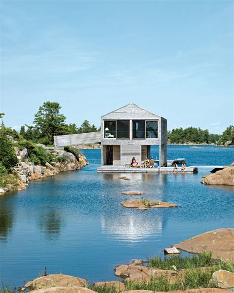 Floating House With An Integrated Boathouse And Dock