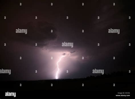 A Single Bolt Lightning Strike During A Night Storm Stock Photo Alamy