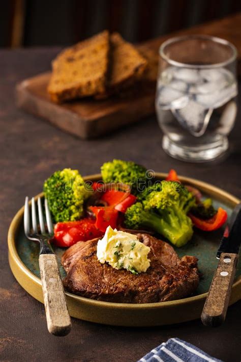 Grilled Beef Steak With Garlic Butter And Vegetables Meat With Stock