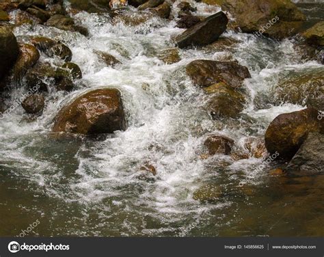 Fresh Water River Among Black Rocks Fresh Aqua Fast Stream In Stones