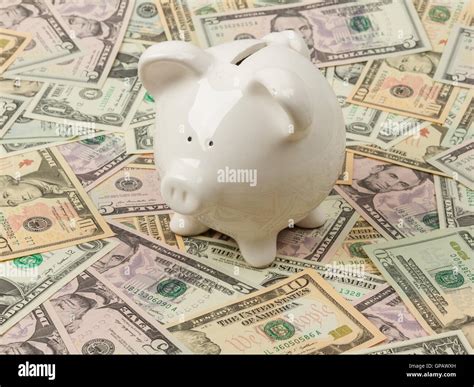 Piggy Bank On Dollar Bills Stock Photo Alamy