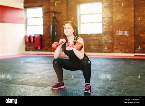 Woman Squatting Hi Res Stock Photography And Images Alamy