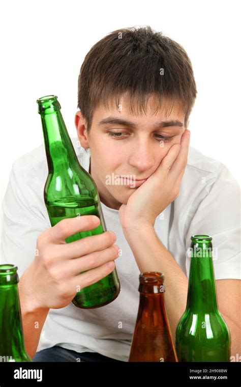 Sad Young Man In Alcohol Addiction On The White Background Stock Photo