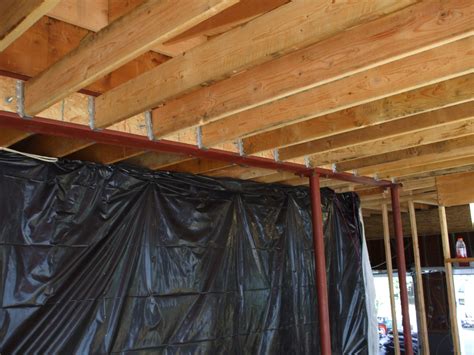 This video shows the typical exposed ceiling layout of a bisf house. Attaching 2x6 Ceiling Joists To Steel Beam, Web Blocking ...