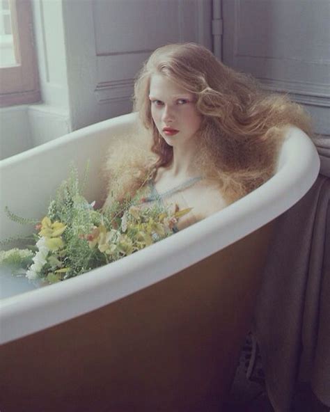 Girl In Bathtub Of Water And Flowers Girl And Woman In Bathtub Of Flowers And Liquid Bath