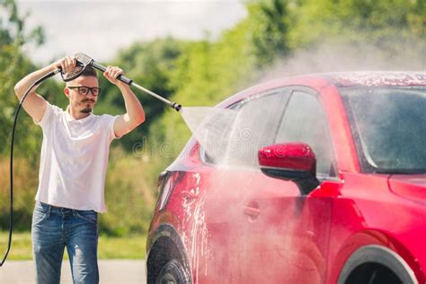 Manual Car Wash With Pressurized Water In Car Wash Outside Summer Car Washing Cleaning Car