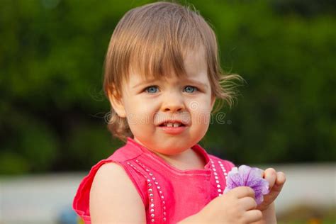 Little Girl Holding Flower Outdoors Stock Photo Image Of Baby Little