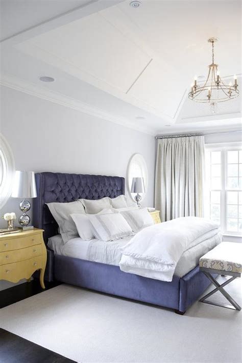Yellow And Blue Bedroom With Yellow Bombay Chests As Nightstands