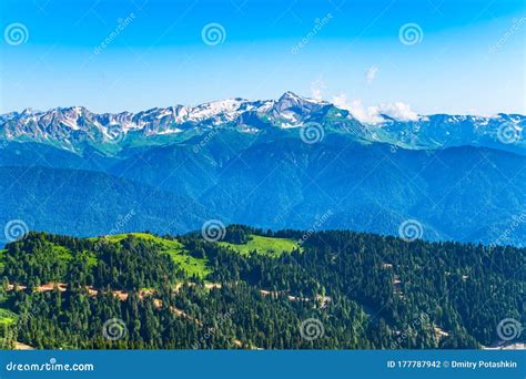Green Mountain Ridges Surrounded By High Mountains Snow Capped