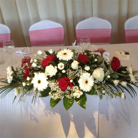 Top Table Arrangement In Roses And Gerbera Red And White Wedding