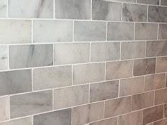 I have always sealed after but i have also done very little work with marble tiles, esp dark. Grout color for white carrera marble tile in shower