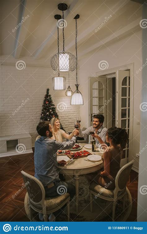 Friends Celebrating Christmas Or New Year Eve At Home Stock Image