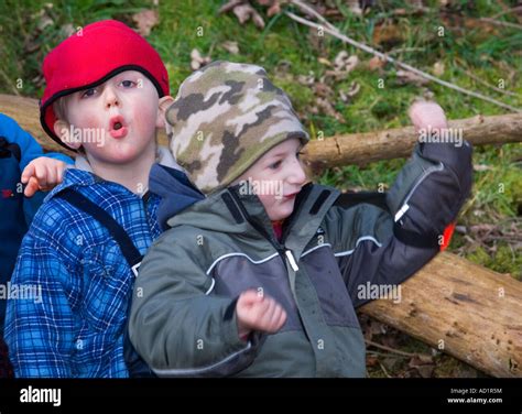 Young Boys Playing In The Woods Scotland Stock Photo Alamy