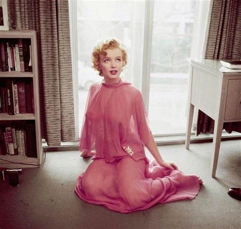 Marilyn Monroe Posing For A Photo In Her Apartment In Taken By Renowned Photographer