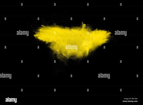 Abstract Yellow Dust Explosion On Black Background Abstract Yellow