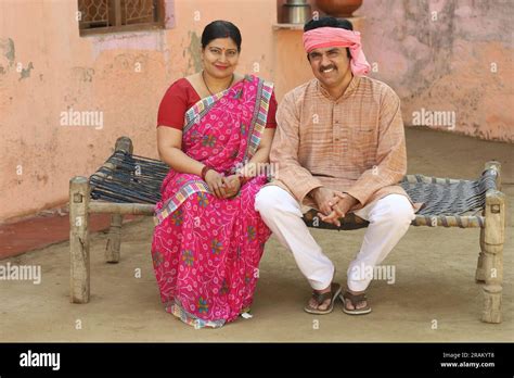 Indian Rural Farmer Couple Sitting Outdoors Together Indian Villagers Attire Husband And Wife