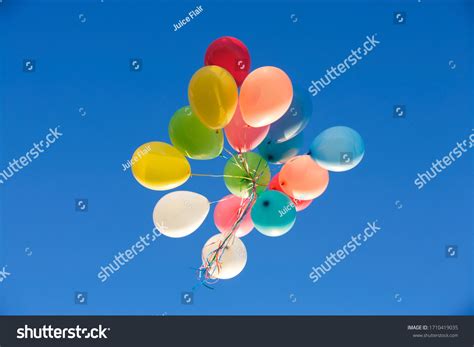 A Bunch Of Balloons Floating Away Royalty Free Stock Photo 1710419035