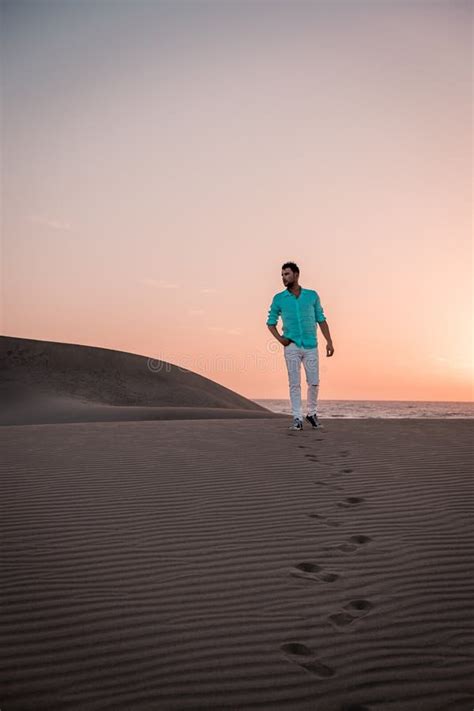Guy Walking At The Beach Of Maspalomas Gran Canaria Spain Men At The
