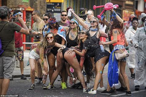 Notting Hill Carnivals Sparks Into Life As Revellers Cover Each Other