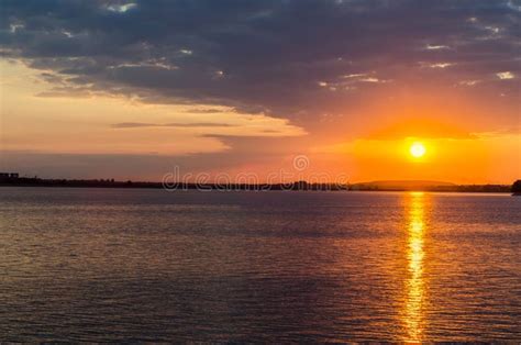 Orange Sunset Over A European Lake Blue Clouds Sky Colored Dra Stock