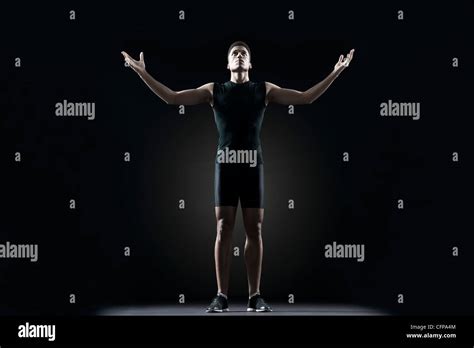 Male Athlete With Arms Outstretched Portrait Stock Photo Alamy