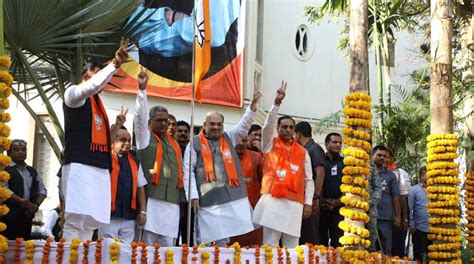 Bjp Leaders Hoist Party Flag As Part Of Campaign Ahead Of Lok Sabha