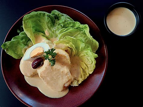 Start by making the dressing, for that to serve a plate of papa a la huancaína, place a lettuce leaf as a base, put a sliced potato on top. Papa a la Huancaina (Peruvian Potato Salad) | Pisco Trail