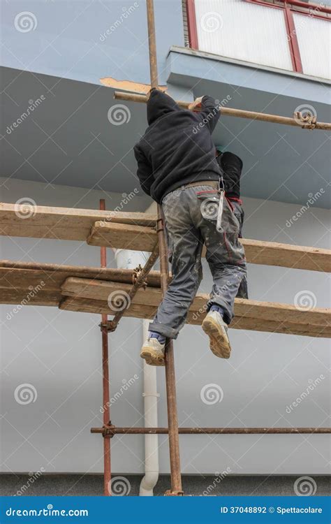 Construction Workers Climbs On Scaffolding Stock Photo Image Of