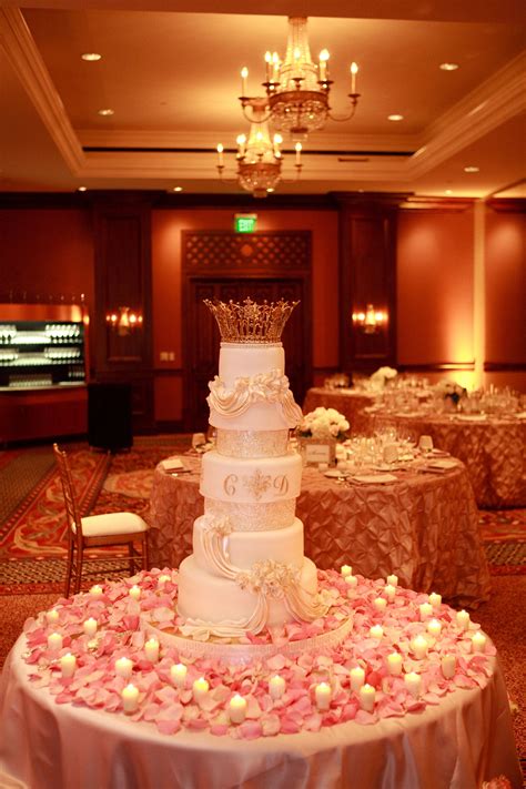 It is made by distilling rose petals in steam. Stunning cake table with pink rose petals and lace votives ...