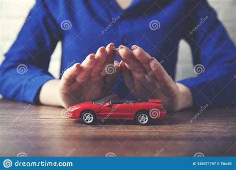 Man Hand Red Car Model on Table Stock Image - Image of brick, drive