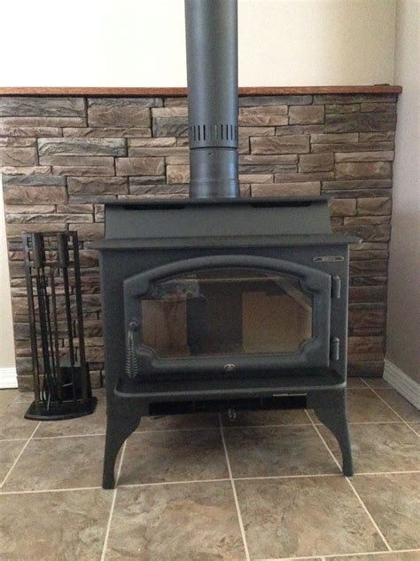 ( mckinley brown ,lowe's), italian porcelain tiles for hearth floor ( lowe's), lopi liberty woodstove ( the fireplace people). Image only : M-Rock I Series stone veneer -SCREWS ON , no ...