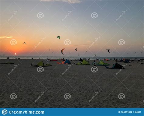 Sunset At Kite Beach Dubai Uae Full Of Colorful Kites Stock Photo