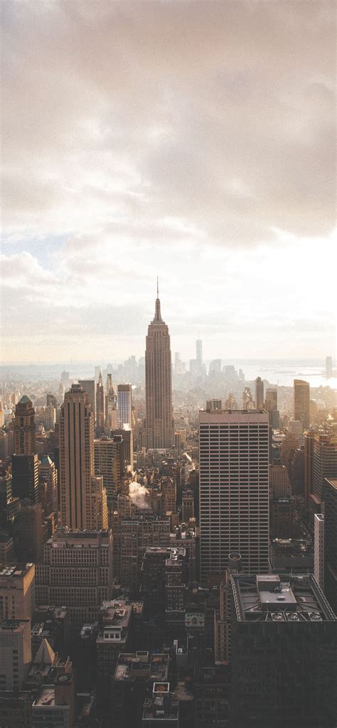 Empire State Building Under Cloudy Sky Iphone Wallpapers Free Download