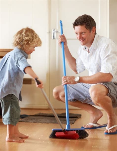 Premium Photo Keeping Things Clean A Father And Toddler Son Sweeping