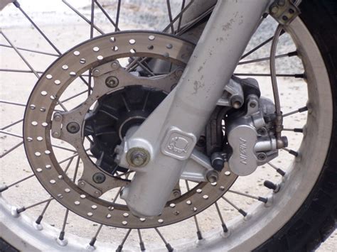 Motorcycle suspension systems can be very complex, and involve numerous variables such as wheelbase, weight, ride height, tire size, suspension sag, and engine placement, in addition to rake and trail. A Quick Guide to Motorcycle Rake, Trail, and Offset, Part ...