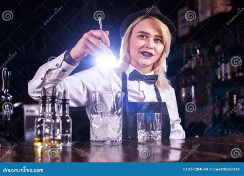 Focused Girl Barman Surprises With Its Skill Bar Visitors On The Bar
