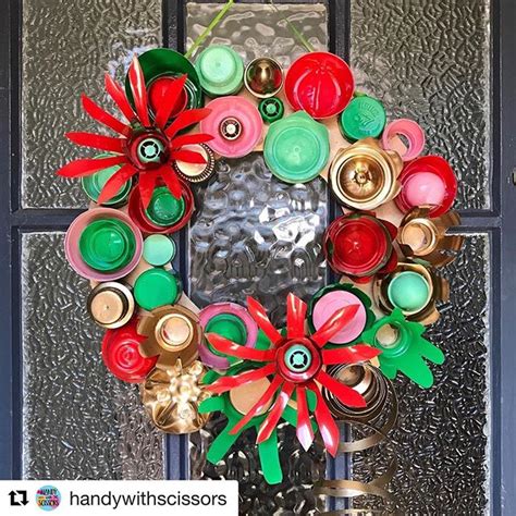 A Christmas Wreath Made Out Of Cans And Buttons On A Glass Door With