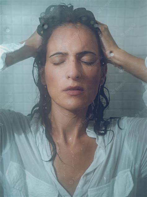 Premium Photo Sensual Hispanic Woman In Shower Cabin With Closed Eyes