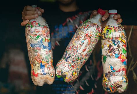 Pack Plastic Wrappers Into Bottles To Create Building Blocks