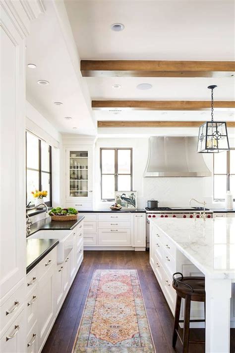 Foxy, alluring and cool are just some of the ways to describe these modern spaces hexagon tiles on the backsplash, interesting lighting and bertoia stools put this modern white kitchen, designed by courtney wilson of <em><a href. 40 Best Modern Farmhouse Kitchen Decor Ideas And Design ...