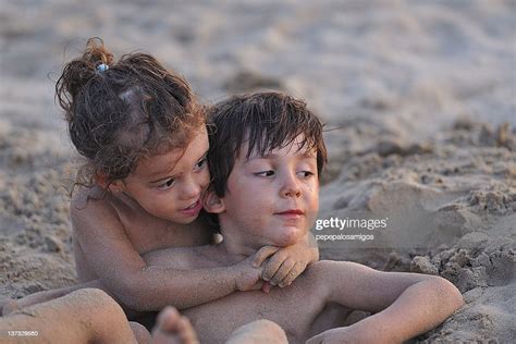 Boy And Girl Playing In Sand Spain High Res Stock Photo Getty Images