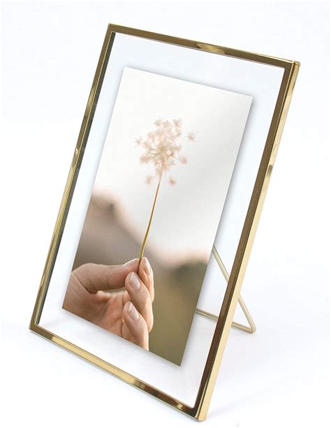 Picture frames can be the most pricey and restrictive part of capturing your favorite photo or picture. Gold Metal Floating Pressed Glass Picture Frame with Metal Easel, Photo Display for Desk (Gold ...