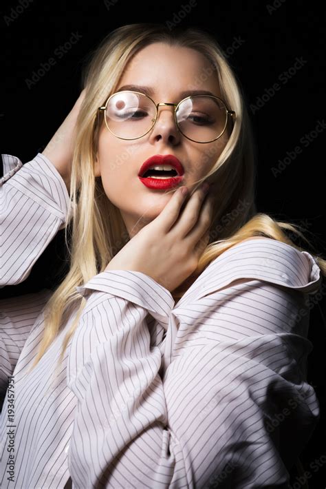 Elegant Blonde Woman In Glasses Wearing Blouse With Naked Shoulders