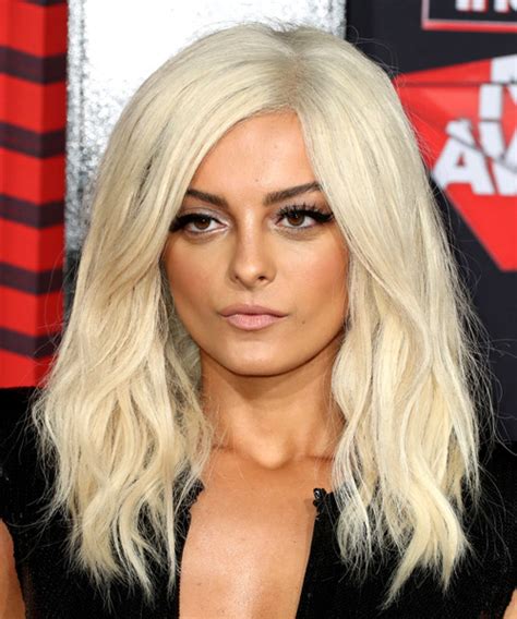 Bebe Rexha Long Wavy Light Blonde Hairstyle