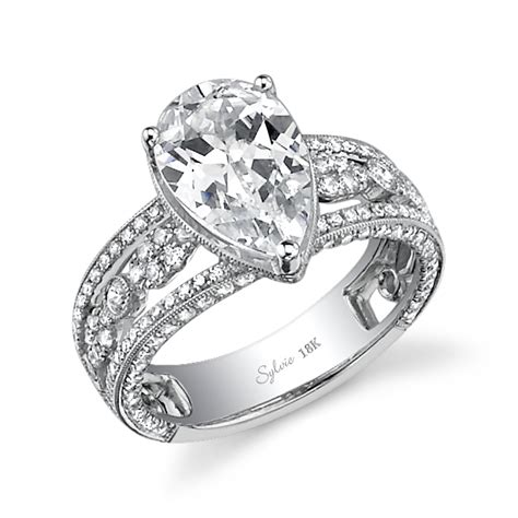 This will allow you to work your aesthetic to your tastes without actually having to invest in the diamonds. Vintage Pear Shaped Engagement Ring | Sylvie