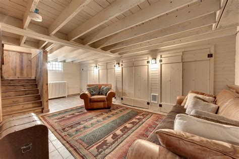 Tin ceiling tiles ceiling panels suspended ceiling systems covering popcorn ceiling basement remodel diy kitchen remodel tongue and groove ceiling ceiling texture rustic basement. Rustic Basement with Wall sconce & Whitewashed exposed ...